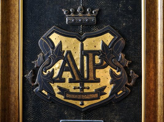 Emblem A.P. of fused glass